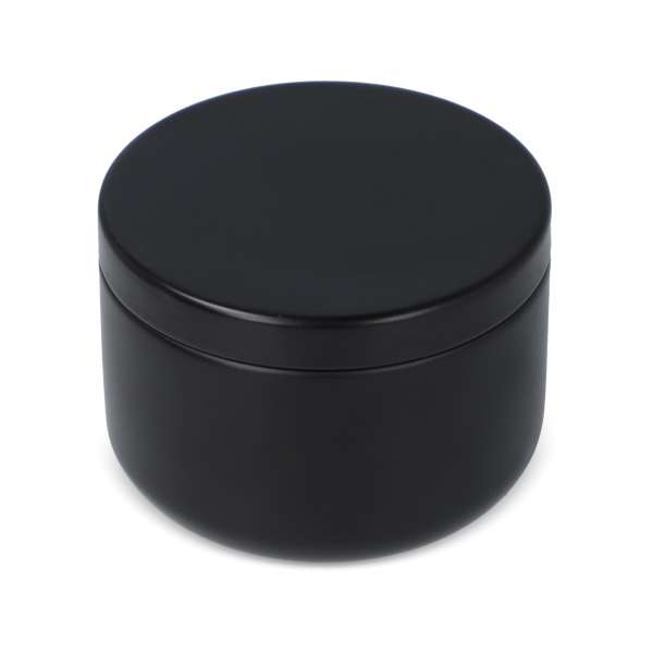 Candle in round recycled tin